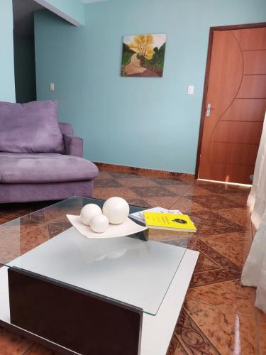 a living room with a table with eggs on it at Triunfo Flat in Triunfo