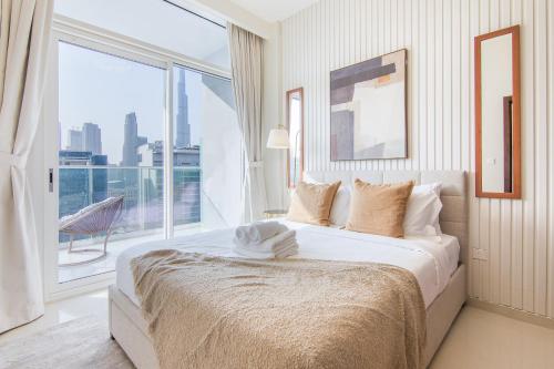 Postel nebo postele na pokoji v ubytování 1 Bedroom Apartment in Business Bay, Burj Khalifa