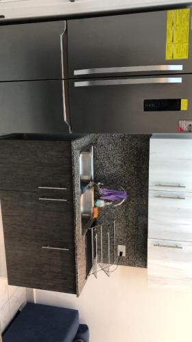 Kuchyň nebo kuchyňský kout v ubytování Airbnb prado1 evaristo