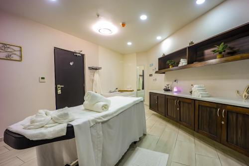 a bathroom with a tub and a sink and a counter at Comfort Inn & Suites Tobago in Tobago Island
