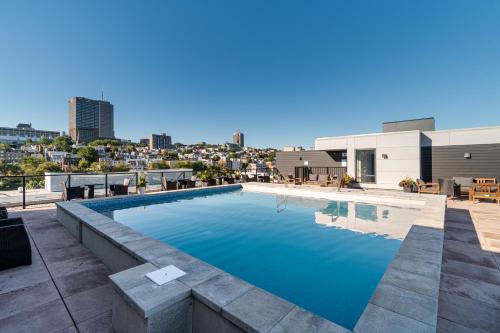 a swimming pool on the roof of a building at 2 Bedroom condo - 800M of Old Quebec ! in Quebec City