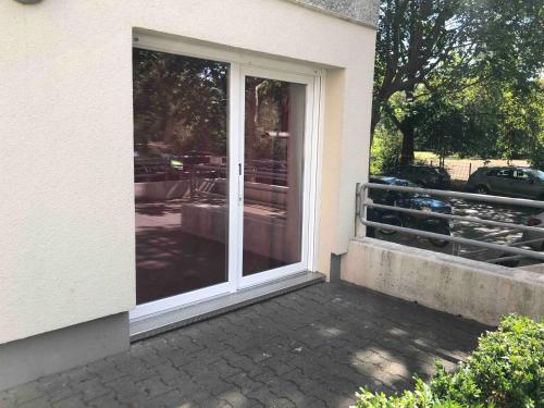 a sliding glass door on the side of a house at Potsdamer Platz-Top Spot Studio 1 in Berlin