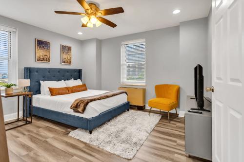 a bedroom with a bed and a flat screen tv at Peachtree Perfect in Atlanta