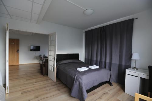 Postel nebo postele na pokoji v ubytování 100 Iceland Hotel