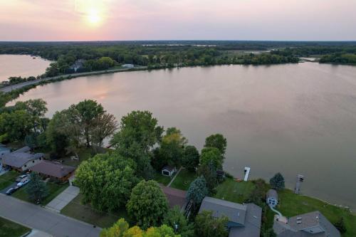 an aerial view of a large lake at sunset at Hugo Home, Direct Lake Access and Private Dock! in Hugo