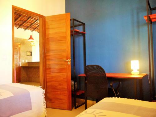 Łóżko lub łóżka w pokoju w obiekcie Natal Casa de Playa Paraiso