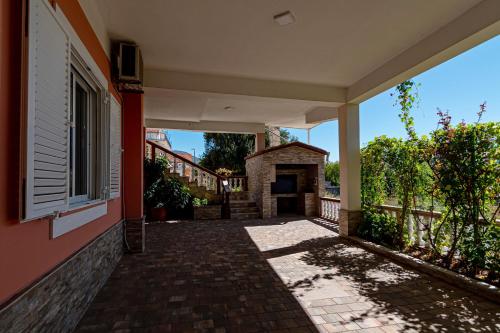 an empty hallway of a house with a brick walkway at Apartments with parking space Orebic, Peljesac - 20010 in Orebić