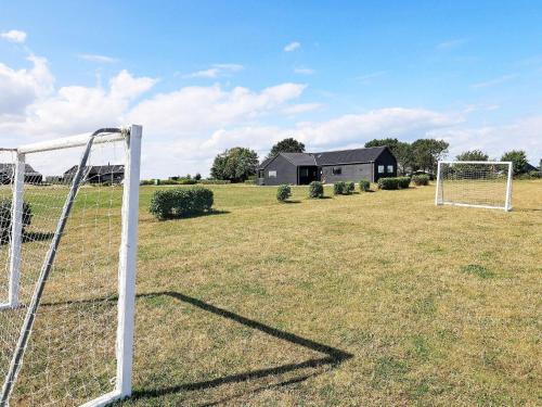 a soccer goal in the middle of a field at 10 person holiday home in Bogense-By Traum in Bogense