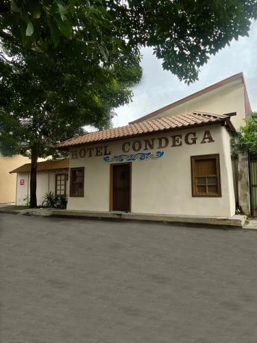 a building with a sign that reads hotel condlez at Hotel Wilson Condega in Liberia