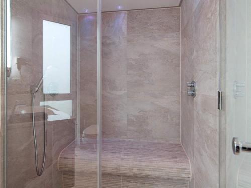 a shower with a glass door in a bathroom at Apartment Wendtorf VII in Wendtorf