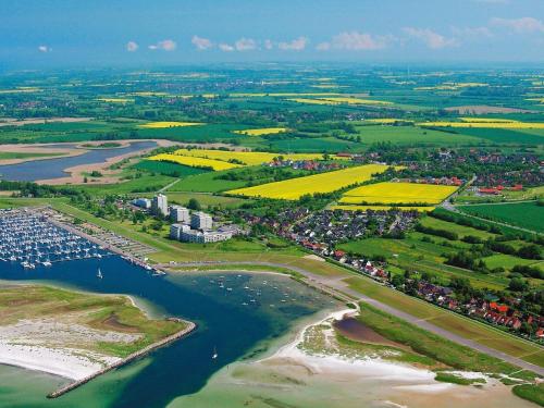 an aerial view of a harbor with boats in the water at 6 Personen Ferienhaus in Wendtorf in Wendtorf