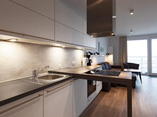 a kitchen with a sink and a counter top at 6 Personen Ferienhaus in Wendtorf in Wendtorf