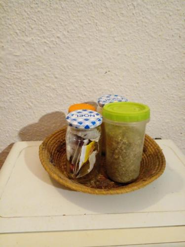 a tray with three jars of food on a table at Dormi en Mar del Plata! in Mar del Plata