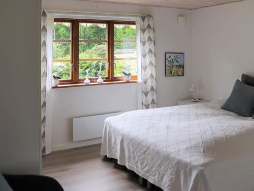 Ένα ή περισσότερα κρεβάτια σε δωμάτιο στο 6 person holiday home in HÄSTVEDA