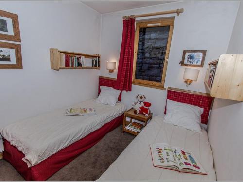 a bedroom with two beds and a window at Appartement Val-d'Isère, 5 pièces, 8 personnes - FR-1-518-104 in Val-d'Isère