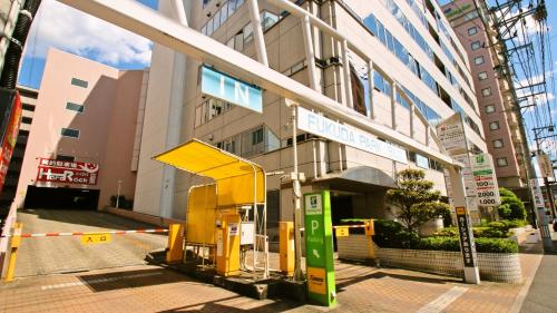 a gas station in front of a building at ANA Holiday Inn Sendai by IHG in Sendai