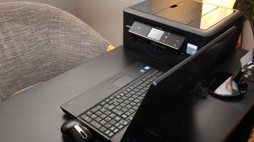 a laptop computer sitting on top of a desk at ANA Holiday Inn Sendai by IHG in Sendai