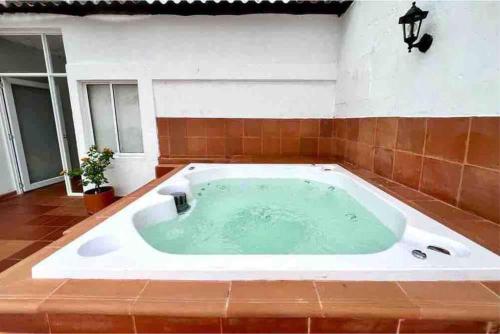 a jacuzzi tub in the middle of a room at 4br LUXURY ROOFTOP oldcity AC jacuzzi hottub wifi in Cartagena de Indias