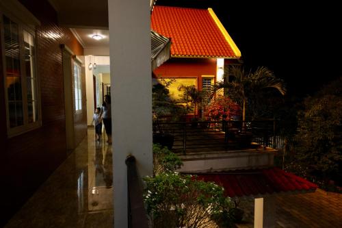 a building with people walking outside at night at Ninh Binh Brother's Homestay in Ninh Binh