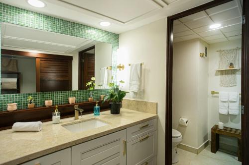 a bathroom with a sink and a mirror at Sunscape Residence Tower in Puerto Vallarta