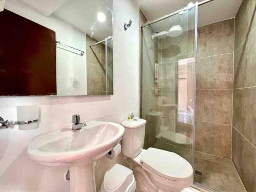 a bathroom with a sink and a toilet and a shower at 5br COZY HOUSE ROOFTOP POOL AC OLD CITY in Cartagena de Indias