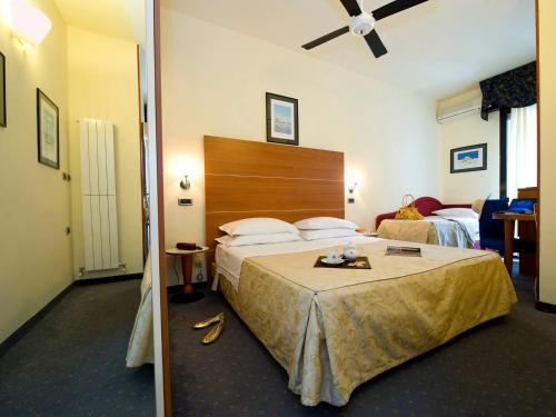 Llit o llits en una habitació de Hotel Corticella