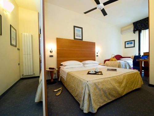 Postel nebo postele na pokoji v ubytování Hotel Corticella