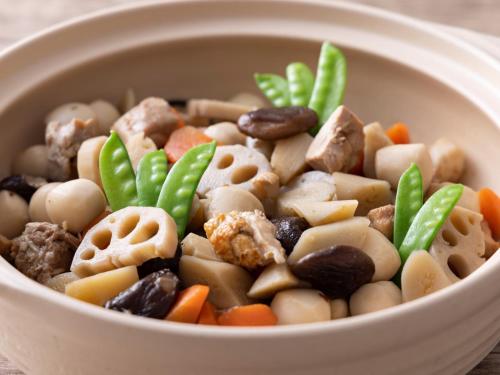 a bowl of food with mushrooms and vegetables at Premier Hotel Mojiko in Kitakyushu