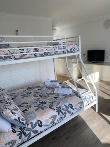 Ένα ή περισσότερα κρεβάτια σε δωμάτιο στο The Harrington Serviced Apartments