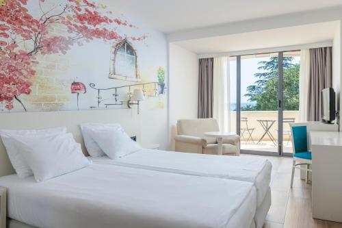 Postel nebo postele na pokoji v ubytování Iberostar Waves Bellevue All Inclusive