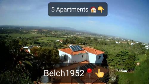 a house with solar panels on the roof at Lopes Apartment - Belch1952 in Lagos