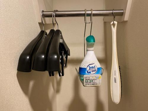 a group of utensils are hanging on a wall at Az Inn Fukui - Vacation STAY 65935v in Fukui