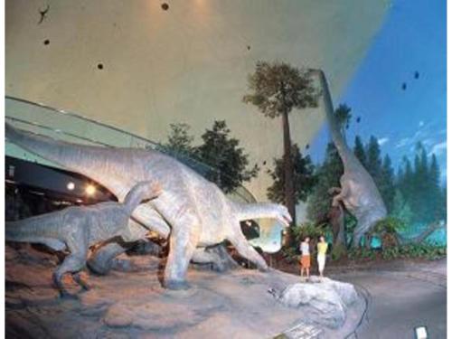 a painting of two dinosaur statues in front of a building at Az Inn Fukui - Vacation STAY 65935v in Fukui