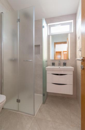 a bathroom with a shower and a sink at Kristi apartment complex near the sandy beach - by TA Leut Agency in Privlaka