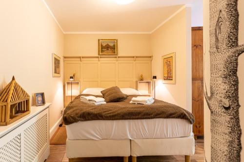 a bedroom with a bed with two towels on it at Christian in Ahrenshoop