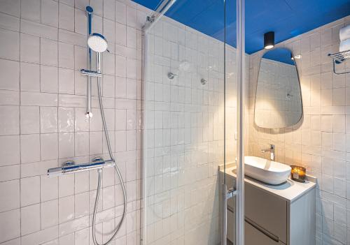 a bathroom with a shower and a sink and a mirror at Malaga Centro Terraza in Málaga