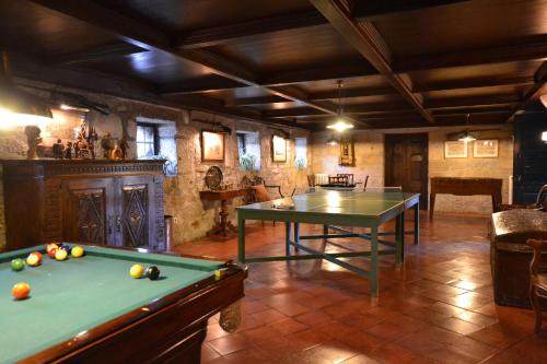 a large room with two pool tables in it at Casa das Paredes in Fafe