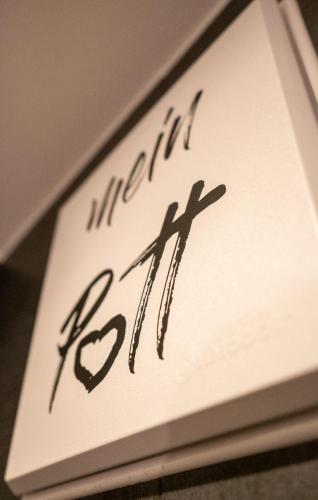 a sign with the word infinity and a heart at Hotel Haus Hohenstein in Witten