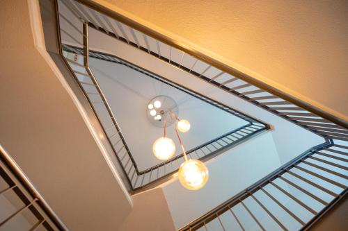 a skylight in a ceiling with a ladder at Hotel Haus Hohenstein in Witten