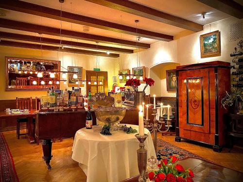 a room with a table with a candle on it at Waldhotel Silbermühle in Horn-Bad Meinberg