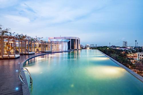 a swimming pool on the roof of a building at Troika Kota Bharu Penthouse Homestay in Kota Bharu