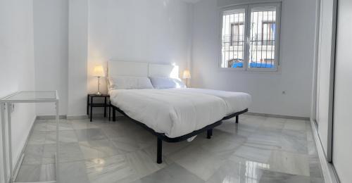 Posteľ alebo postele v izbe v ubytovaní Apartamentos Registro Ronda Centro