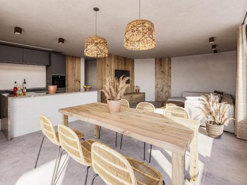 バルダーシュヴァングにある4Monkeys Apartmentsのキッチン、ダイニングルーム(木製のテーブルと椅子付)