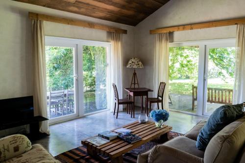 a living room with a couch and a table at Wine Tourism - Quinta do Ameal in Refoios do Lima