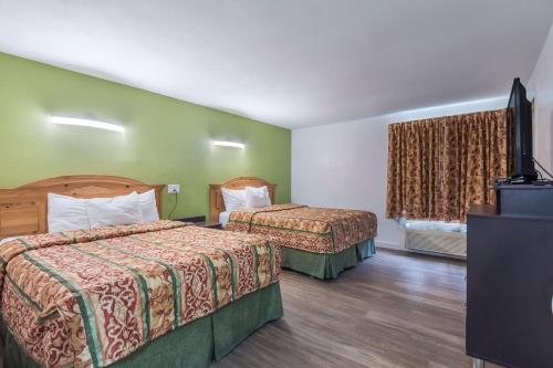 Ένα ή περισσότερα κρεβάτια σε δωμάτιο στο Hotel Oriskany