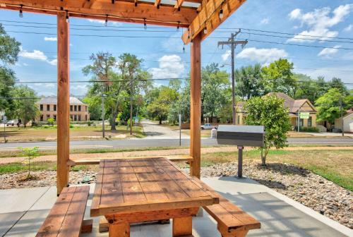 a wooden picnic table with a sign in a park at Super 8 by Wyndham Palestine TX in Palestine