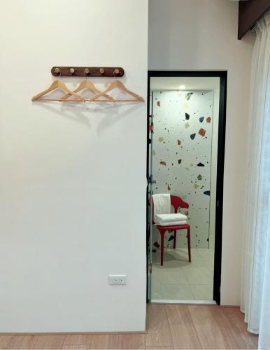 a door leading into a room with a climbing wall at HoME-Easyhouse-III in Tainan