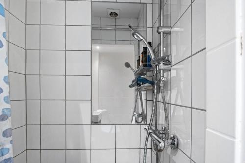 a shower in a bathroom with a shower at ApartmentInCopenhagen Apartment 602 in Copenhagen
