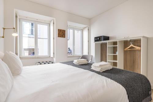 Ένα ή περισσότερα κρεβάτια σε δωμάτιο στο Garcia 28 by LovelyStay