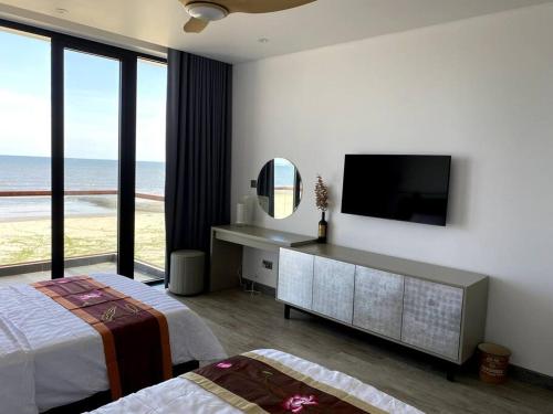 Postel nebo postele na pokoji v ubytování Biệt thự nghỉ dưỡng mặt biển, cao cấp và riêng tư